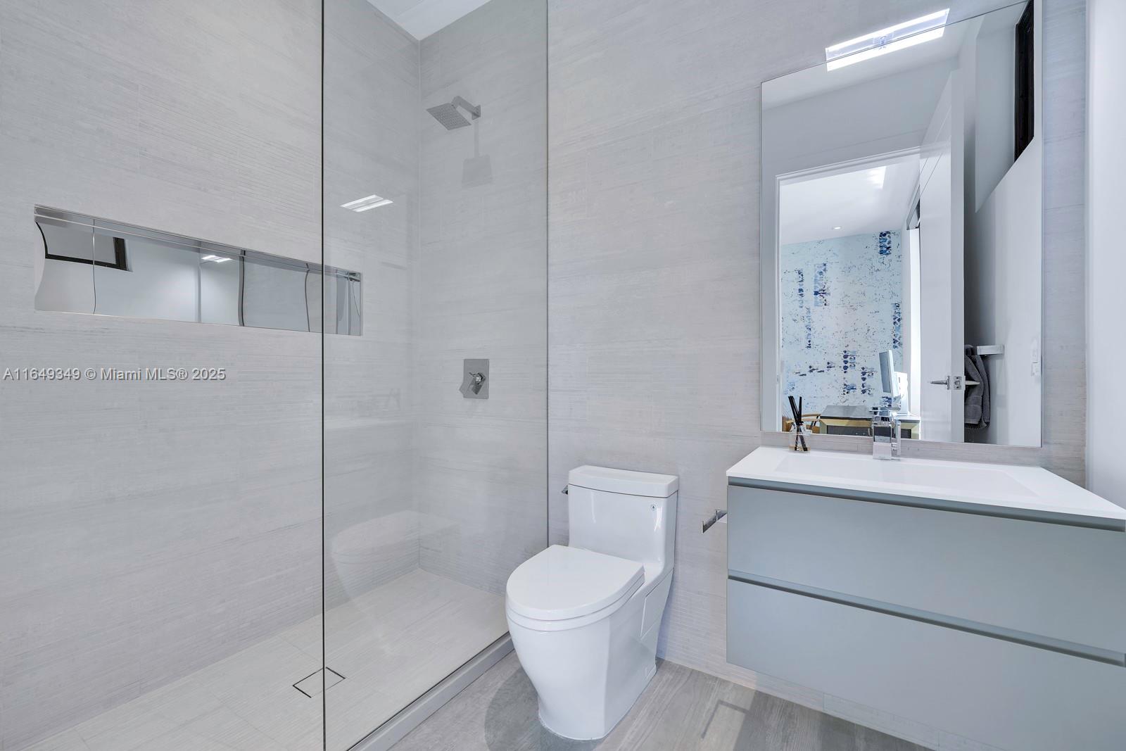 7900 Southwest 54th Avenue Miami, FL 33143 - Photo 34 of 63 a bathroom with a toilet sink and shower