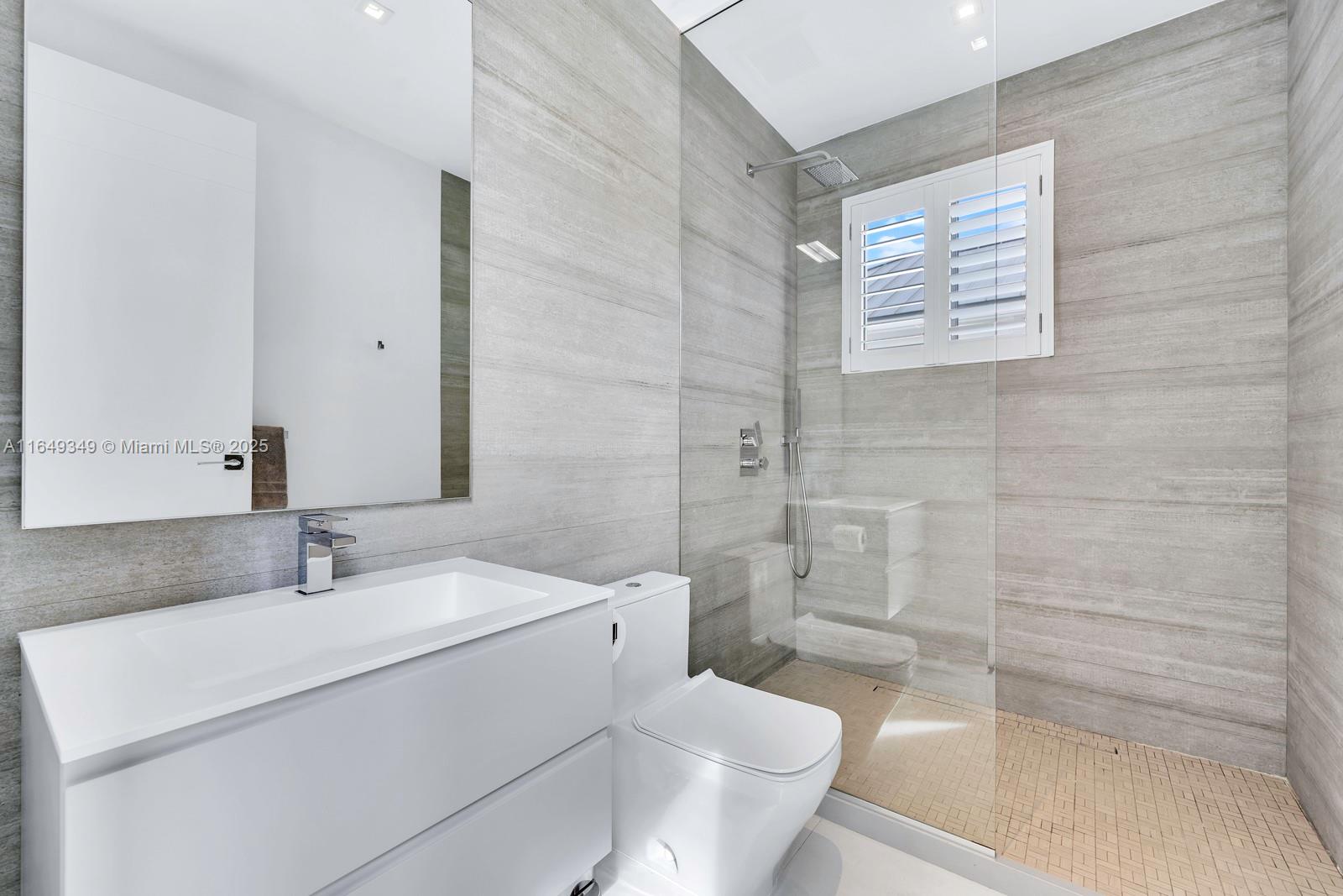 7900 Southwest 54th Avenue Miami, FL 33143 - Photo 36 of 63 a bathroom with a sink toilet and shower