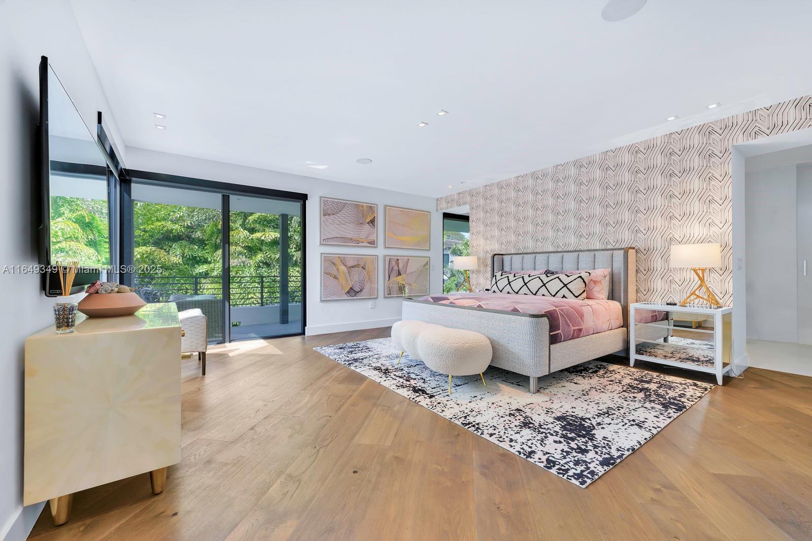 7900 Southwest 54th Avenue Miami, FL 33143 - Photo 44 of 63 a bedroom with a bed wooden floor and lamp