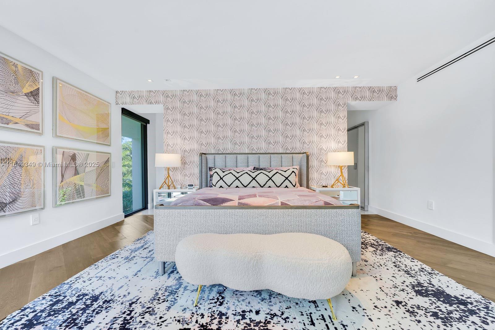 7900 Southwest 54th Avenue Miami, FL 33143 - Photo 45 of 63 a spacious bedroom with a bed and wooden floor