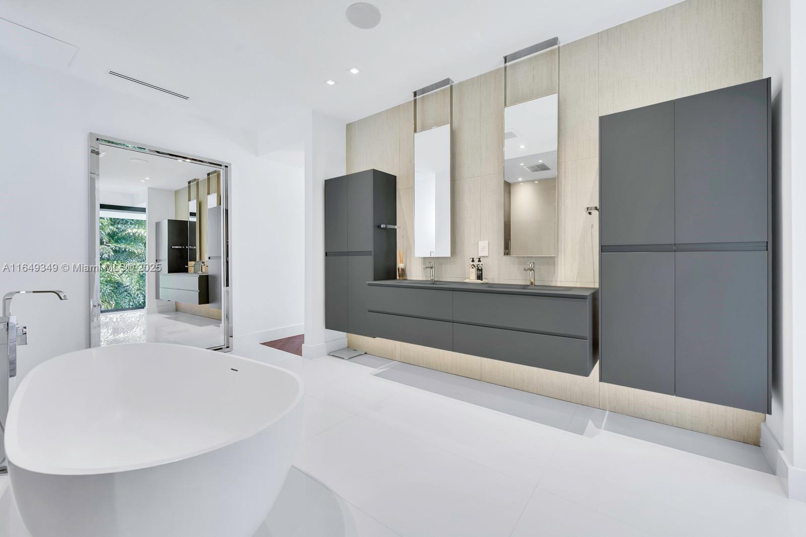 7900 Southwest 54th Avenue Miami, FL 33143 - Photo 49 of 63 a bathroom with a bathtub and a sink