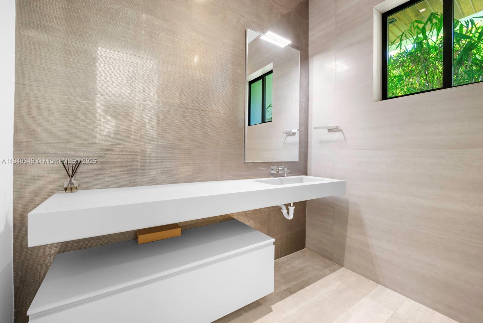 7900 Southwest 54th Avenue Miami, FL 33143 - Photo 5 of 63 a bathroom with a bathtub and a sink