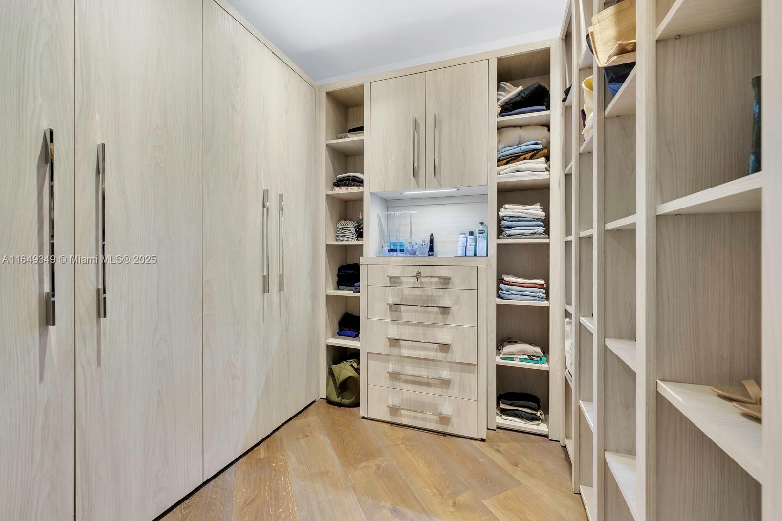 7900 Southwest 54th Avenue Miami, FL 33143 - Photo 52 of 63 a view of walk in closet with clothes and shoes