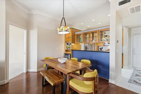 a view of a dining room with furniture wooden floor and chandelier