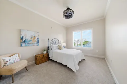 a bedroom with a bed and a couch