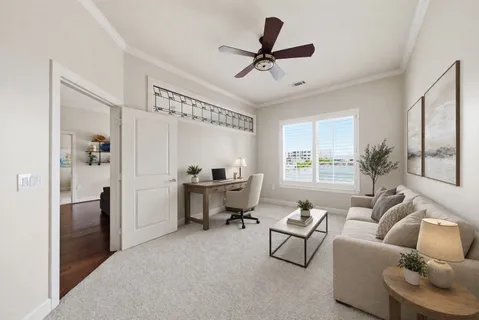a living room with furniture and a window