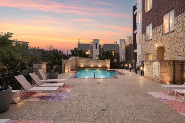 a view of a patio with a table and chairs