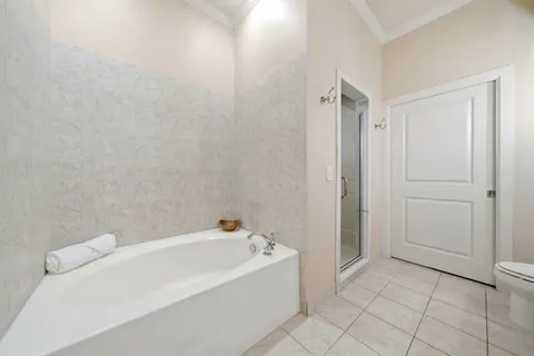 a bathroom with a bathtub and shower
