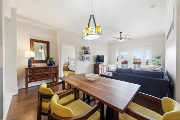 a view of a dining room with furniture and wooden floor
