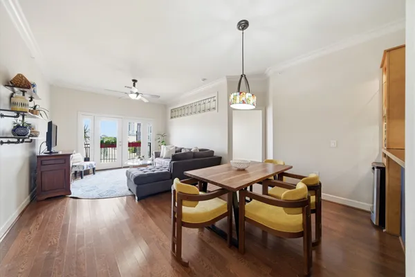 a view of a dining room with furniture and wooden floor
