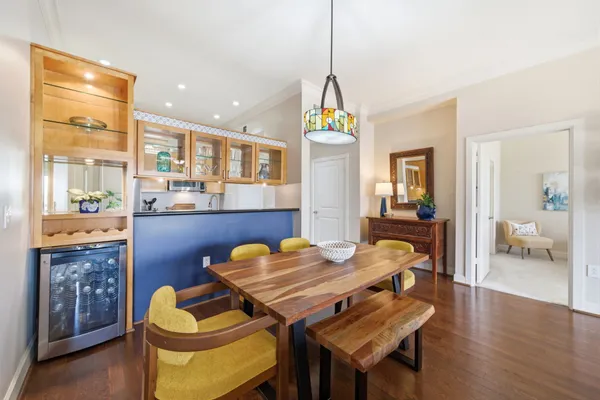 a view of a dining room with furniture and wooden floor