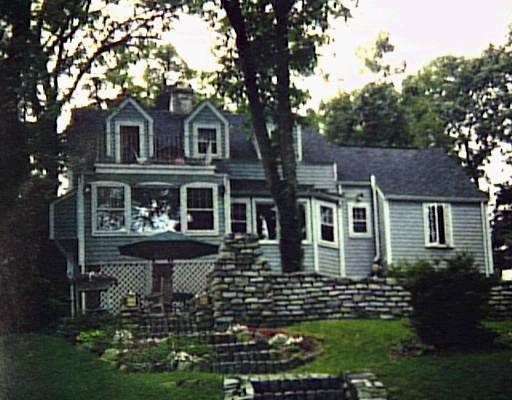 100 Booth Hill Road Trumbull, CT 06611 - Photo 1 of 1 a front view of a house with a yard