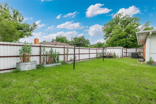 a view of a backyard with a garden