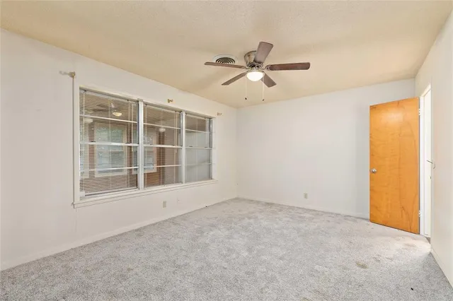 a view of empty room with windows