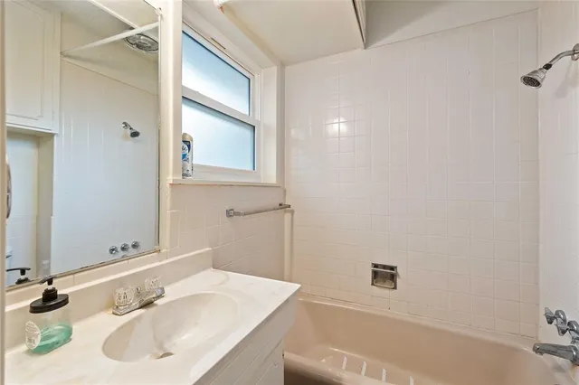 a bathroom with a sink and a bathtub