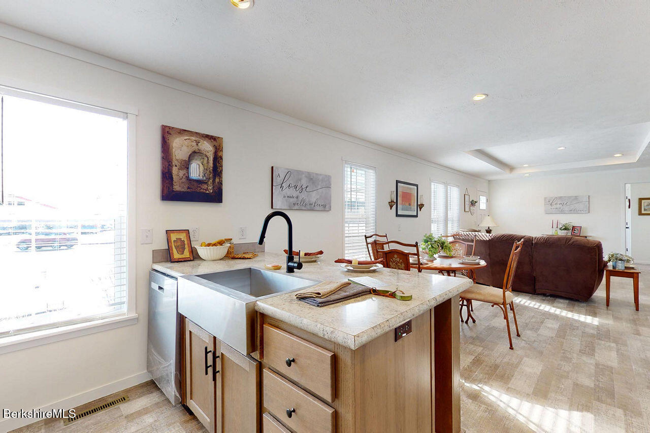 395 Cheshire Road, Unit 117 Pittsfield, MA 01201 - Photo 2 of 9 Kitchen to Living
