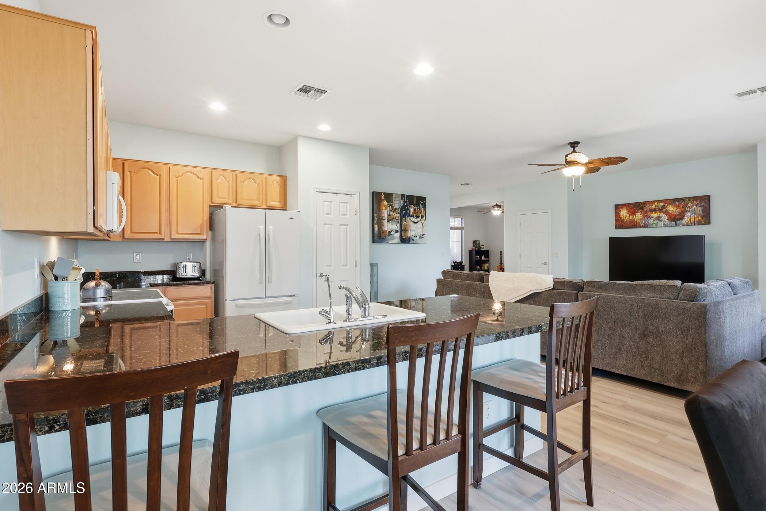 20357 North Lemon Drop Drive Maricopa, AZ 85138 - Photo 14 of 39 a view of a dining room with furniture