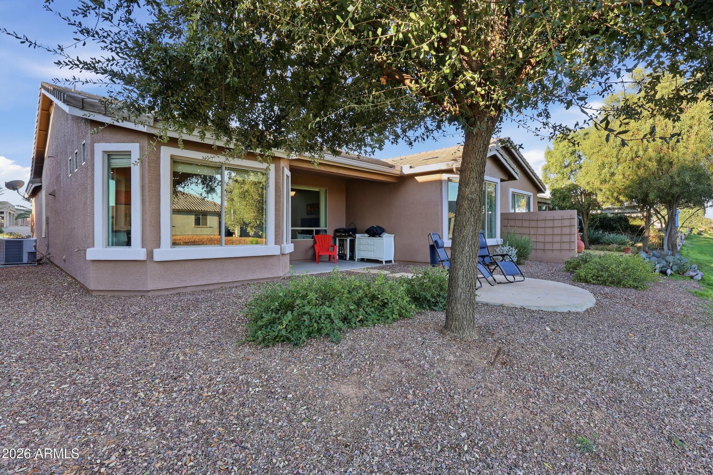 20357 North Lemon Drop Drive Maricopa, AZ 85138 - Photo 29 of 39 a front view of a house with garden