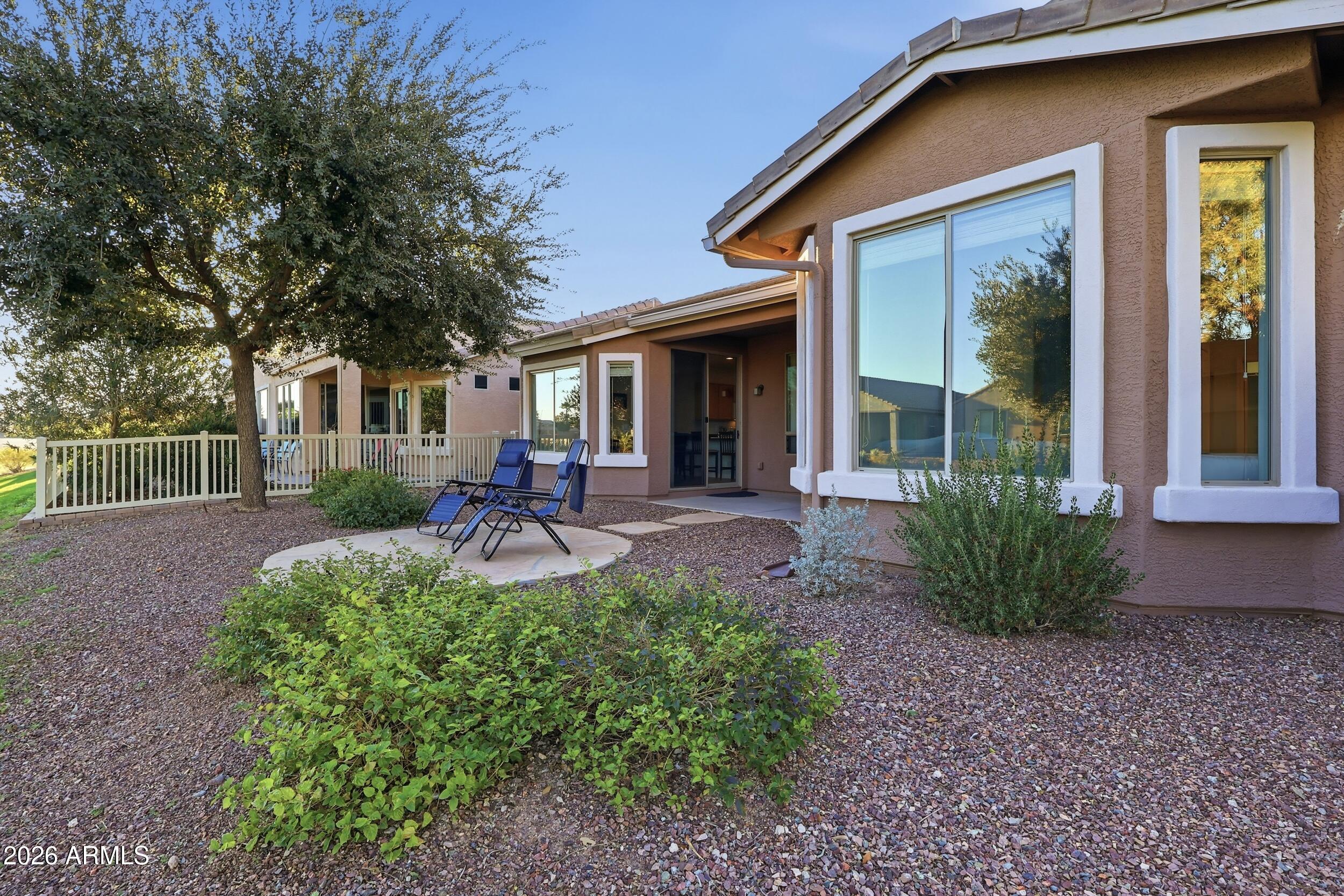 20357 North Lemon Drop Drive Maricopa, AZ 85138 - Photo 31 of 39 a front view of a house with yard and green space