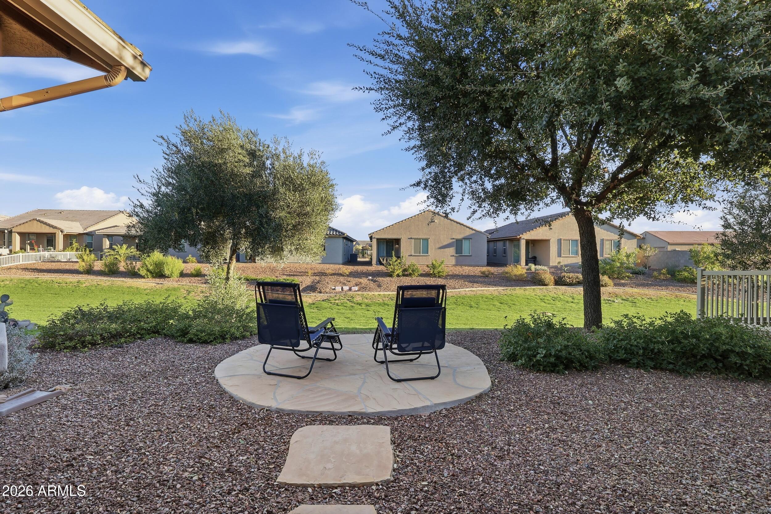 20357 North Lemon Drop Drive Maricopa, AZ 85138 - Photo 32 of 39 a view of a house with backyard porch and sitting area