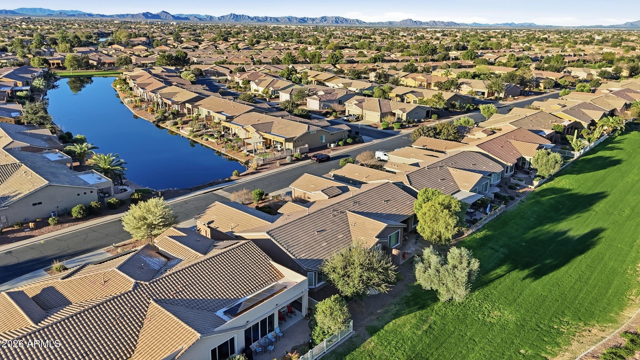 20357 North Lemon Drop Drive Maricopa, AZ 85138 - Photo 37 of 39 an aerial view of residential houses with outdoor space