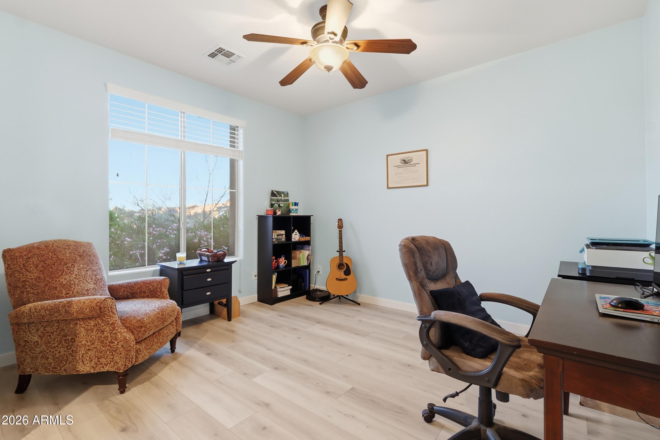 20357 North Lemon Drop Drive Maricopa, AZ 85138 - Photo 6 of 39 a work room with furniture and a window