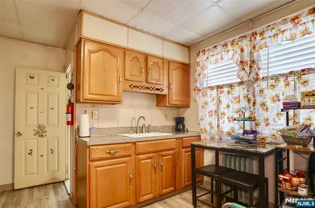 a kitchen with stainless steel appliances granite countertop a sink and cabinets