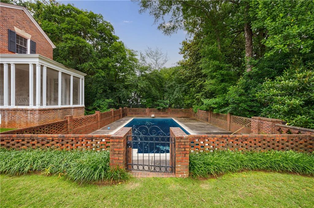 280 Blackland Road Northwest Atlanta, GA 30342 - Photo 7 of 17 a backyard of a house with a garden and plants