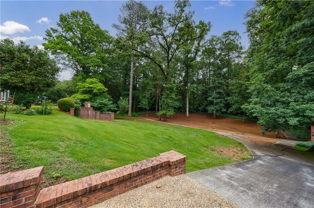 a view of a park with large trees