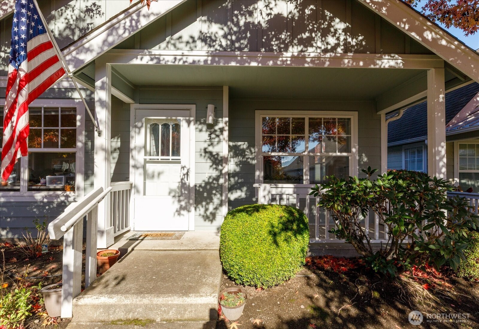 161 West Whidbey Avenue, Unit 5 Oak Harbor, WA 98277 - Photo 13 of 32 front view of a house with a patio