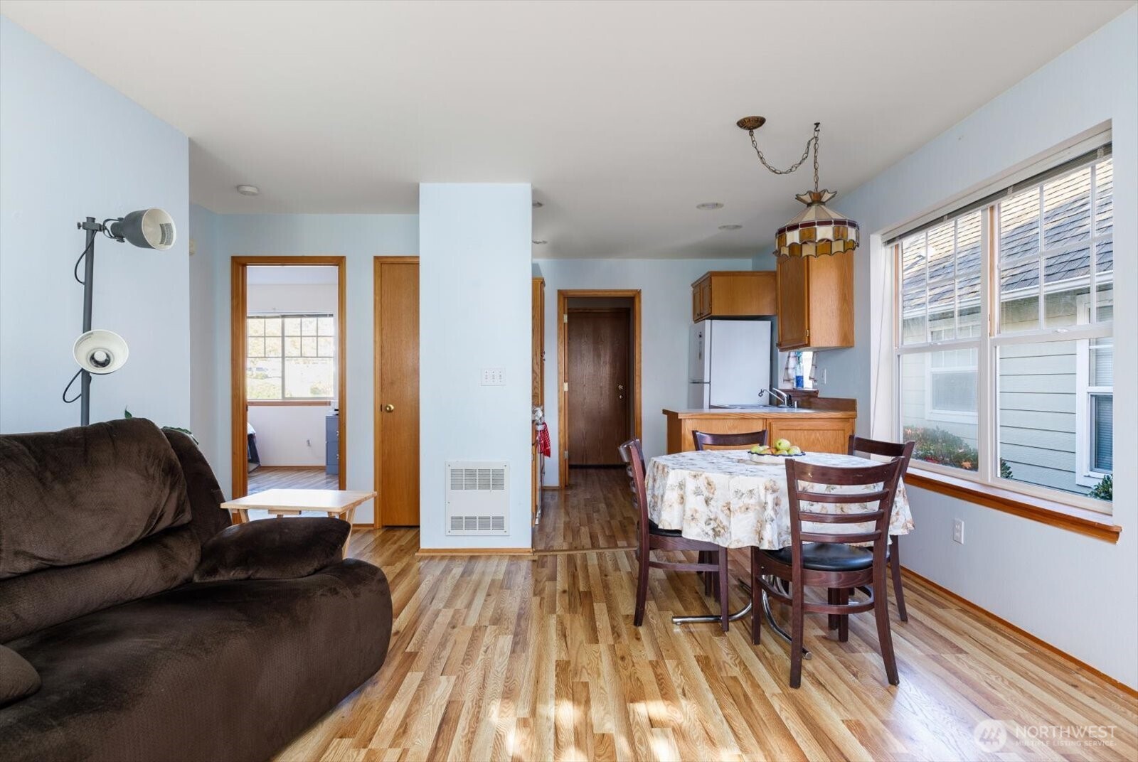 161 West Whidbey Avenue, Unit 5 Oak Harbor, WA 98277 - Photo 17 of 32 a living room with furniture and a wooden floor