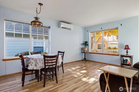 a view of a dining room with furniture window and wooden floor