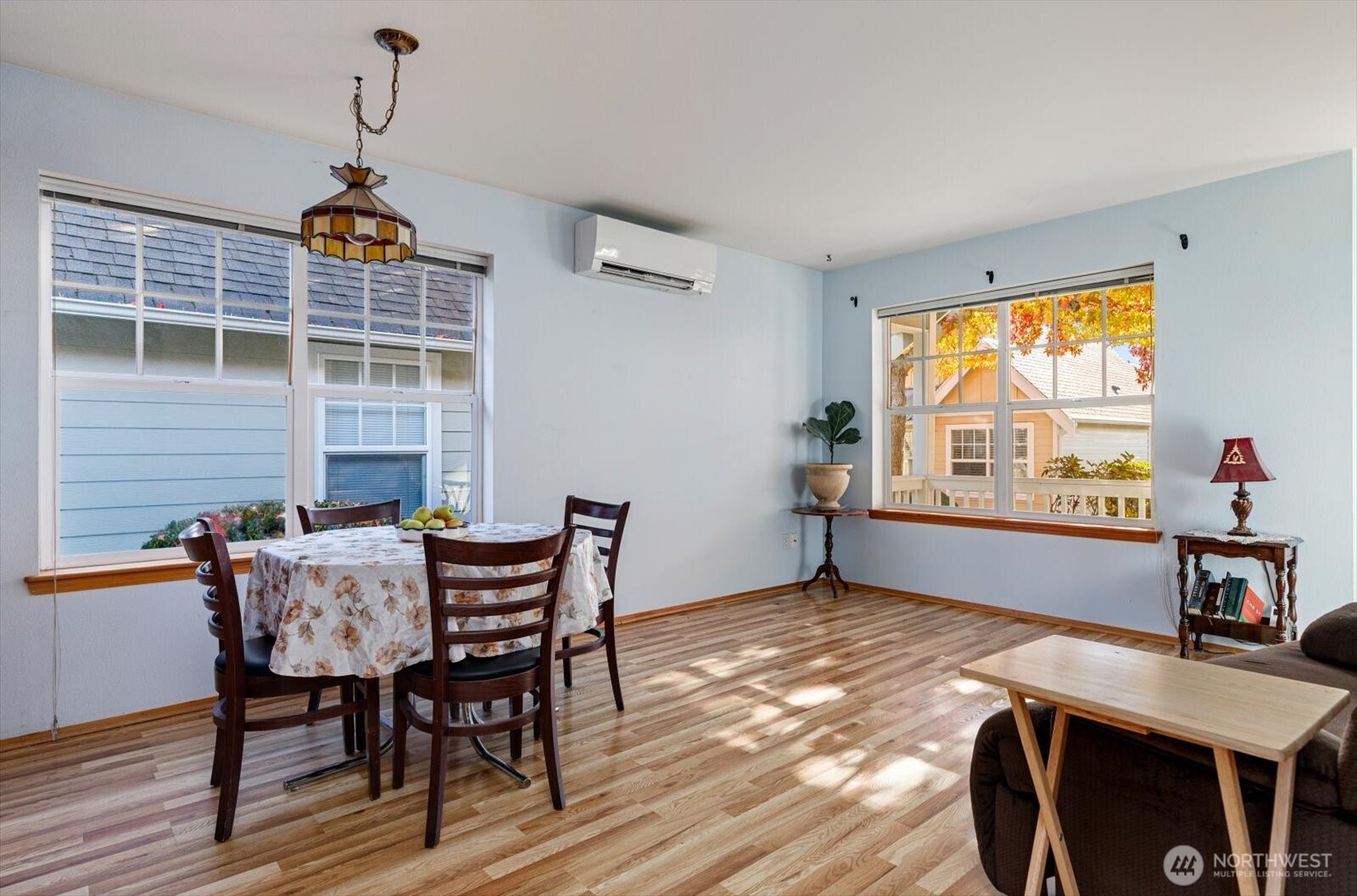 161 West Whidbey Avenue, Unit 5 Oak Harbor, WA 98277 - Photo 3 of 32 a view of a dining room with furniture window and wooden floor