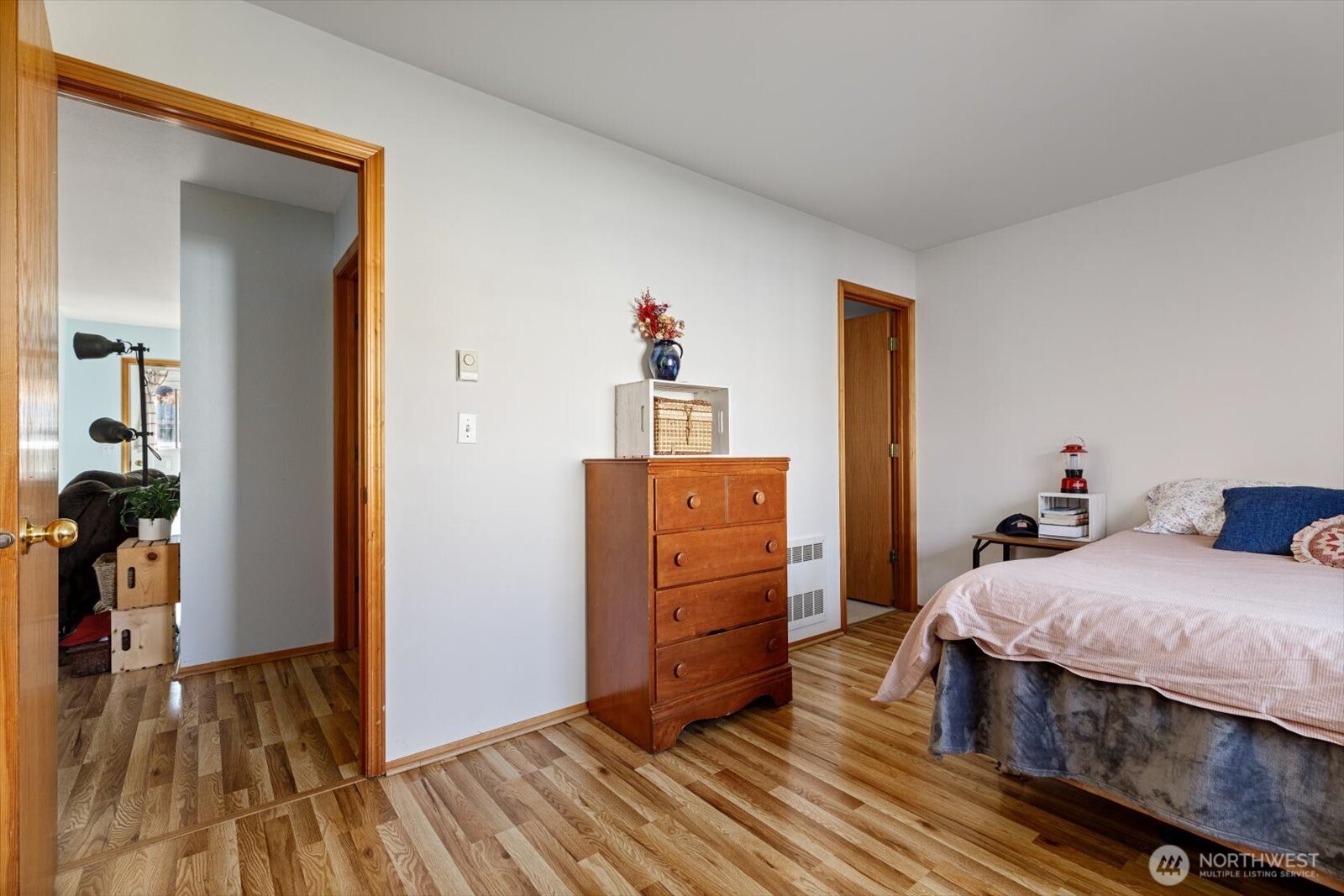 161 West Whidbey Avenue, Unit 5 Oak Harbor, WA 98277 - Photo 6 of 32 a bedroom with a bed and wooden floor