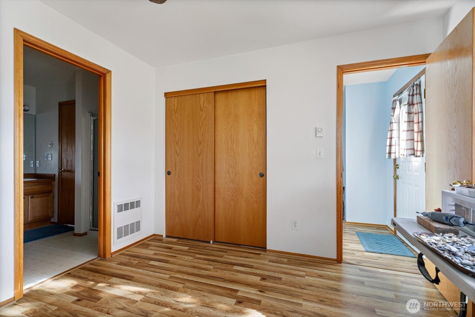 161 West Whidbey Avenue, Unit 5 Oak Harbor, WA 98277 - Photo 7 of 32 a view of a livingroom with wooden floor and closet