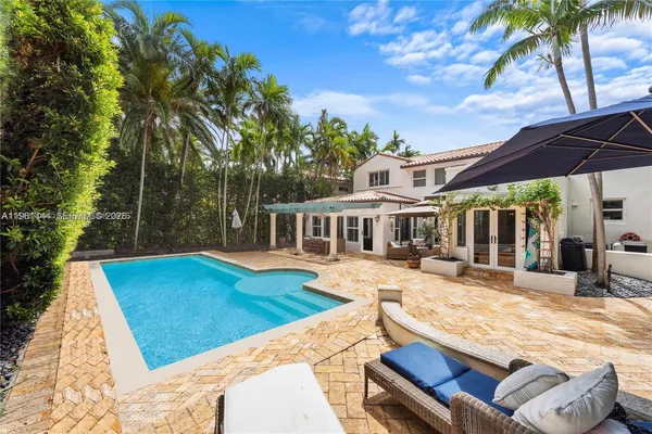 a view of a patio with swimming pool