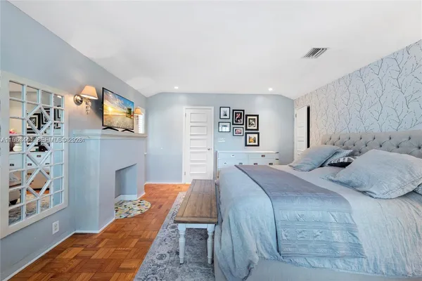 a bed room with a bed and a fish tank