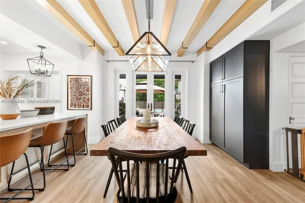 a dining room with furniture and window