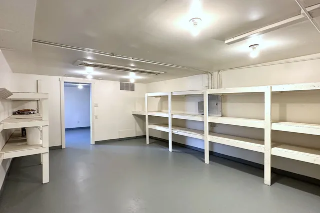 a view of an empty room with empty racks