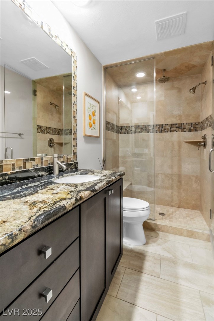 108 Quail Run Road Henderson, NV 89014 - Photo 33 of 50 Bathroom with vanity and a stall shower
