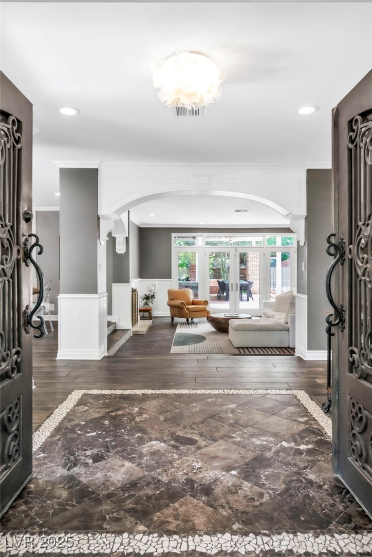 108 Quail Run Road Henderson, NV 89014 - Photo 42 of 50 Entrance foyer featuring dark wood finished floors, wainscoting, french doors, crown molding, and recessed lighting