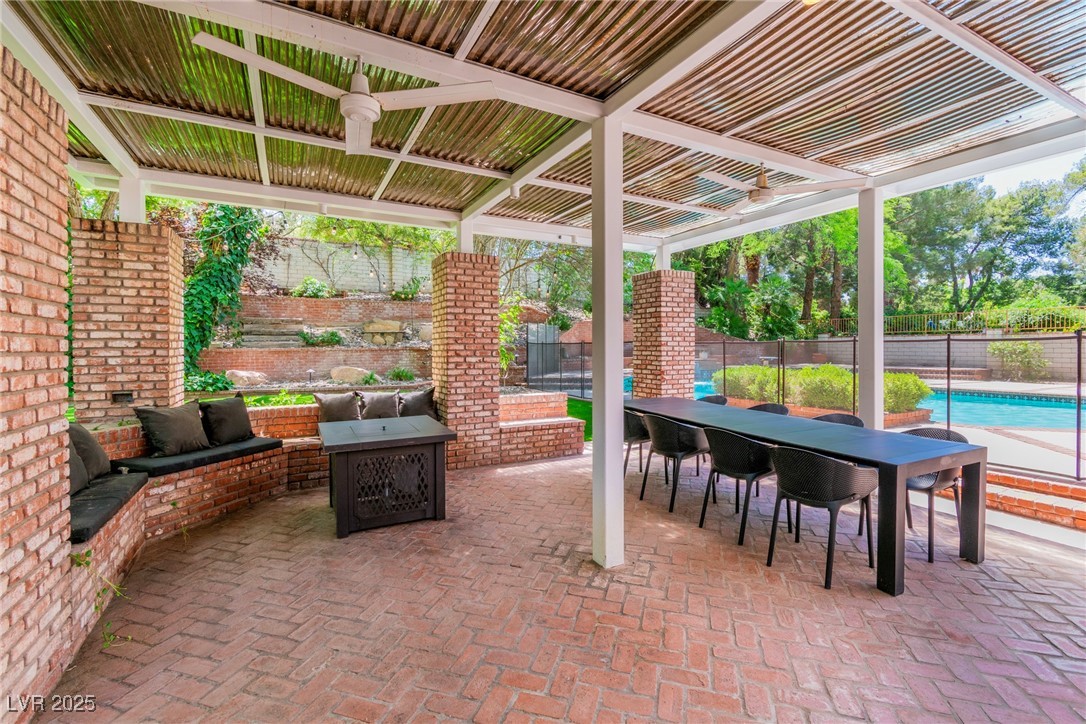 108 Quail Run Road Henderson, NV 89014 - Photo 10 of 50 Fenced backyard with a patio area and outdoor dining space