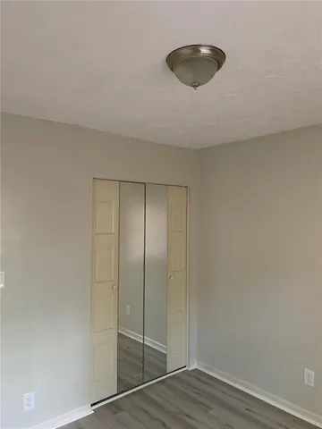 a white bath tub sitting next to a white toilet and sink