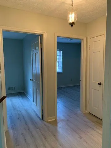 a bathroom with a shower and a sink