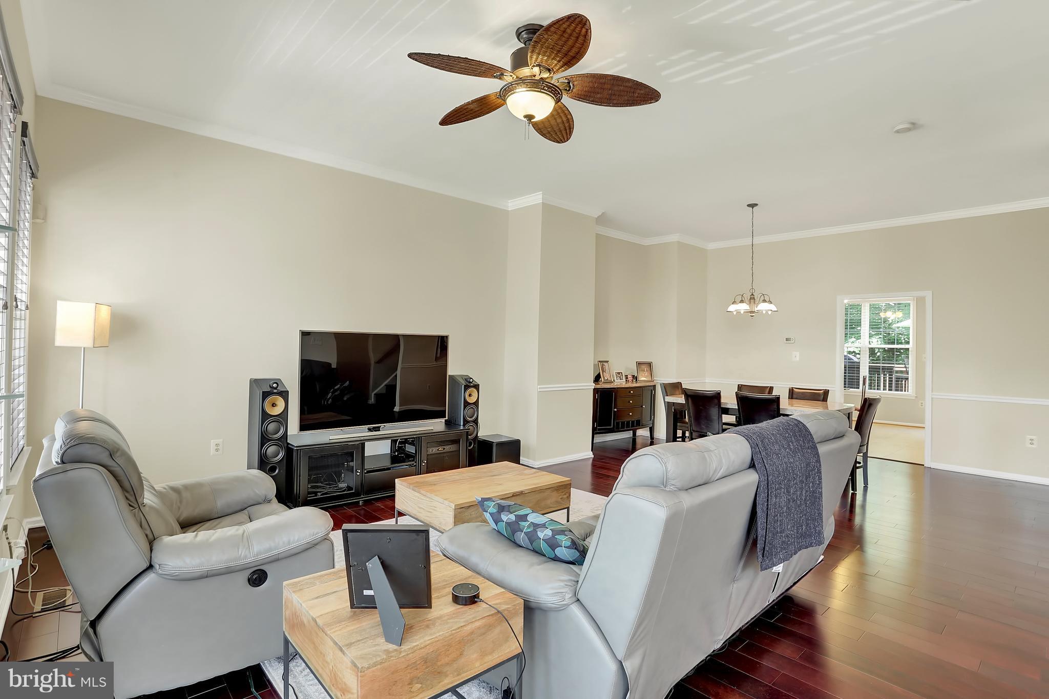 20693 Riptide Square Sterling, VA 20165 - Photo 13 of 30 a living room with furniture and a flat screen tv