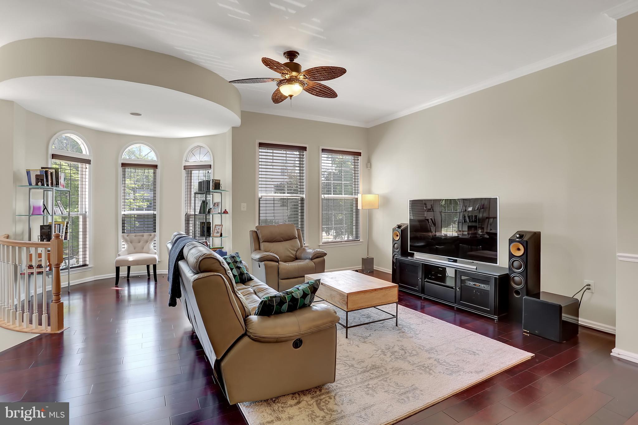 20693 Riptide Square Sterling, VA 20165 - Photo 14 of 30 a living room with furniture and a flat screen tv