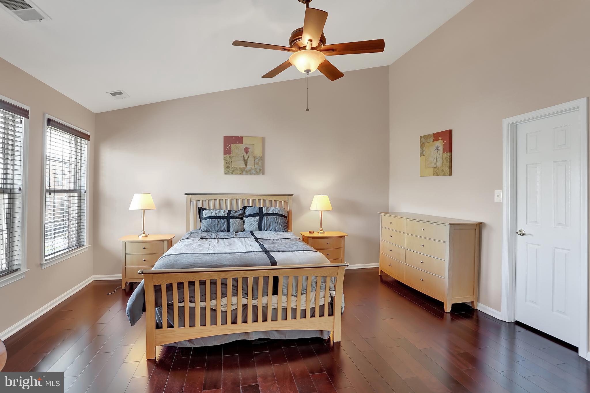 20693 Riptide Square Sterling, VA 20165 - Photo 15 of 30 a bedroom with a bed and a table