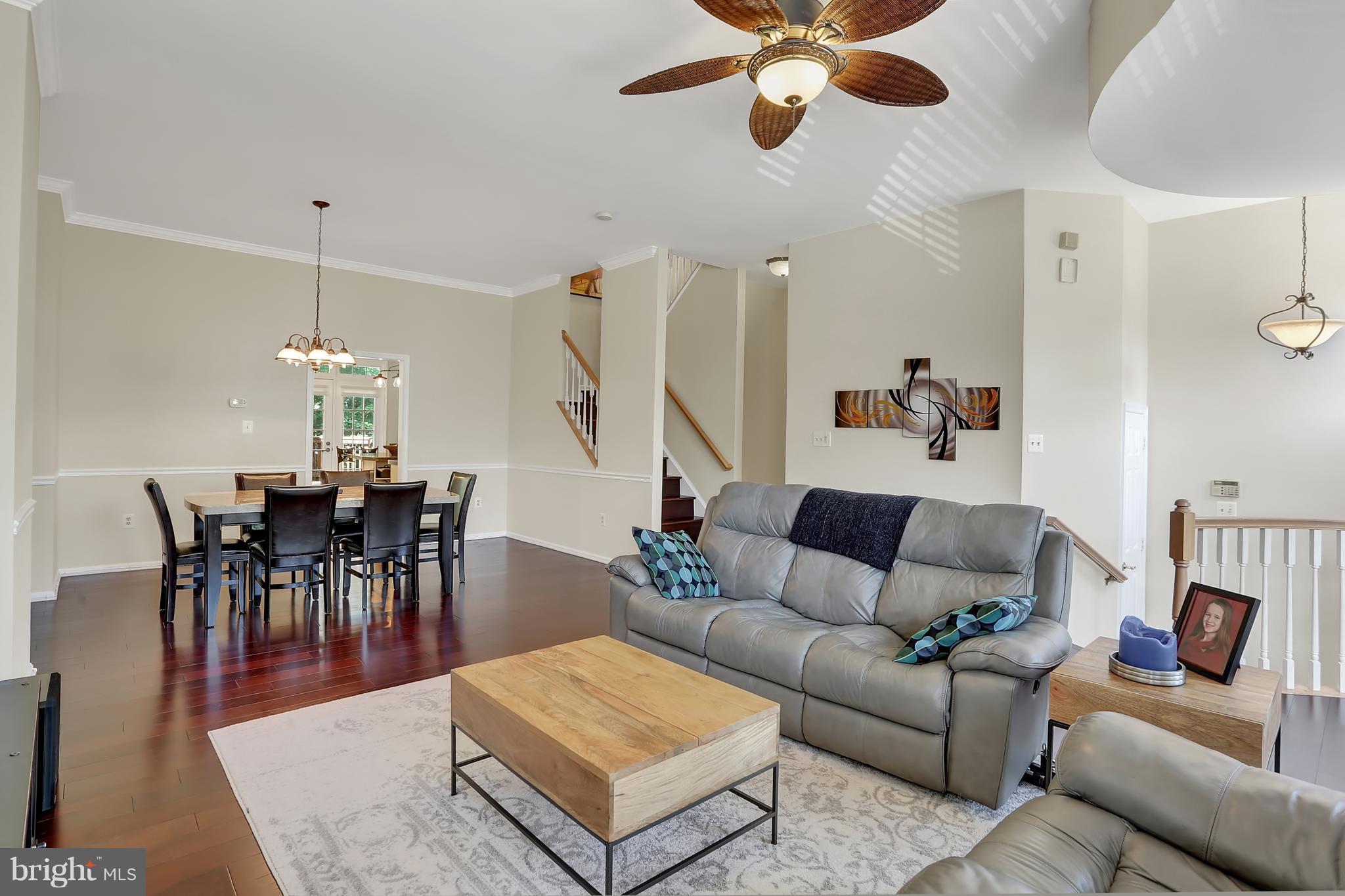20693 Riptide Square Sterling, VA 20165 - Photo 3 of 30 a living room with furniture and a dining table