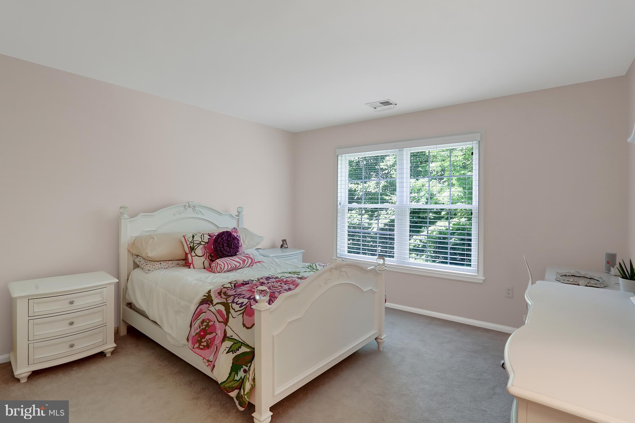 20693 Riptide Square Sterling, VA 20165 - Photo 22 of 30 a bedroom with a bed and a window