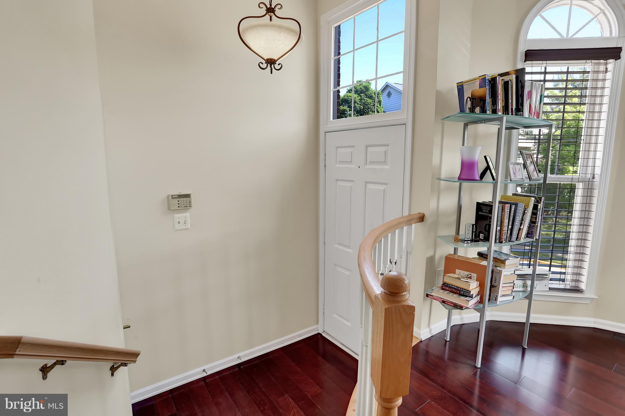 20693 Riptide Square Sterling, VA 20165 - Photo 25 of 30 a view of entryway with wooden floor